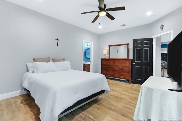 bedroom featuring hardwood / wood-style flooring, ceiling fan, and ensuite bathroom