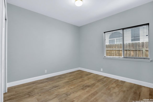 spare room with light hardwood / wood-style flooring