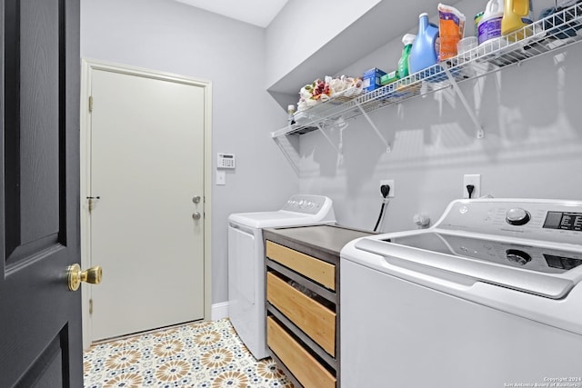 clothes washing area with washer and dryer