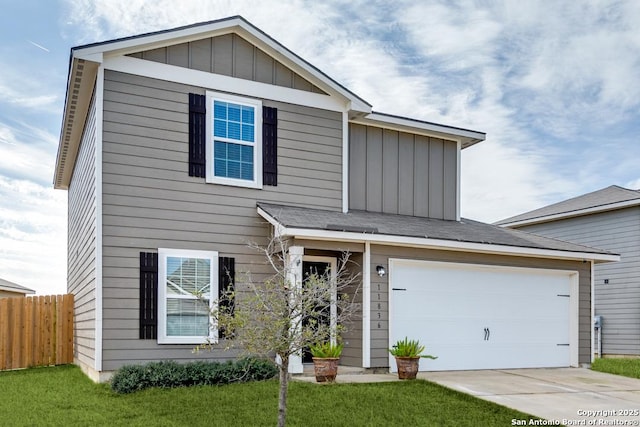 view of front of home with a garage and a front yard