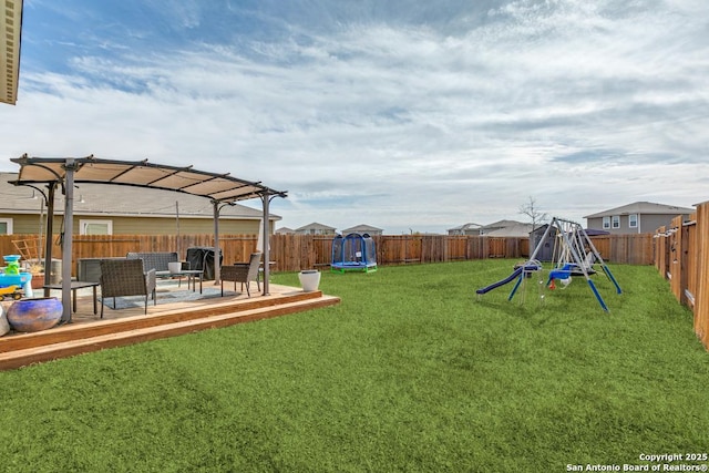 view of yard featuring a playground, an outdoor living space, a trampoline, and a pergola