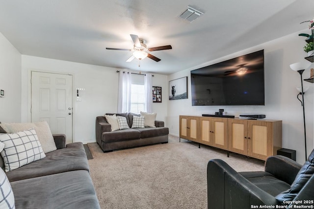 living room featuring ceiling fan and light carpet