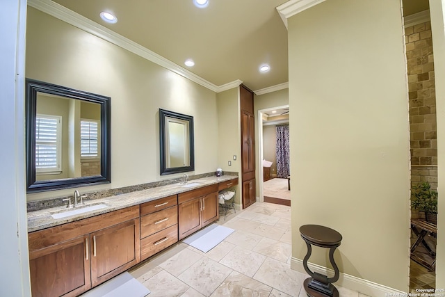 bathroom with ornamental molding and vanity