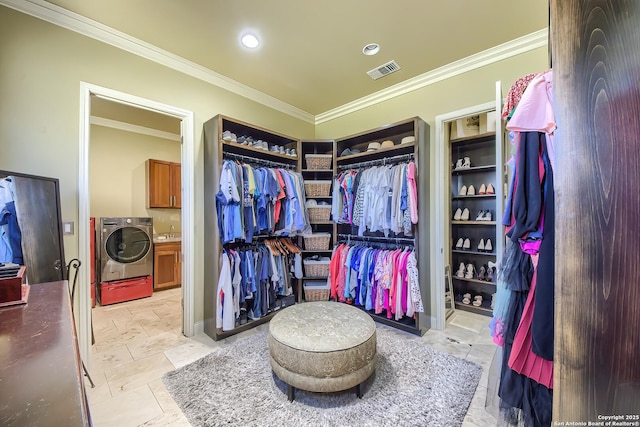 walk in closet featuring washer / dryer