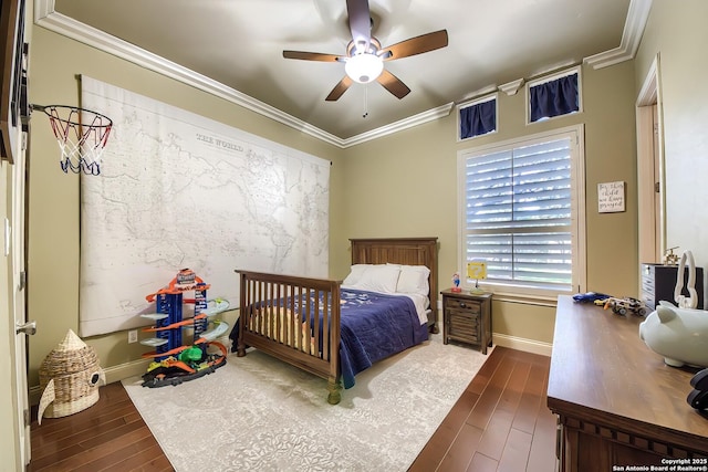 bedroom featuring crown molding, ceiling fan, and dark hardwood / wood-style floors