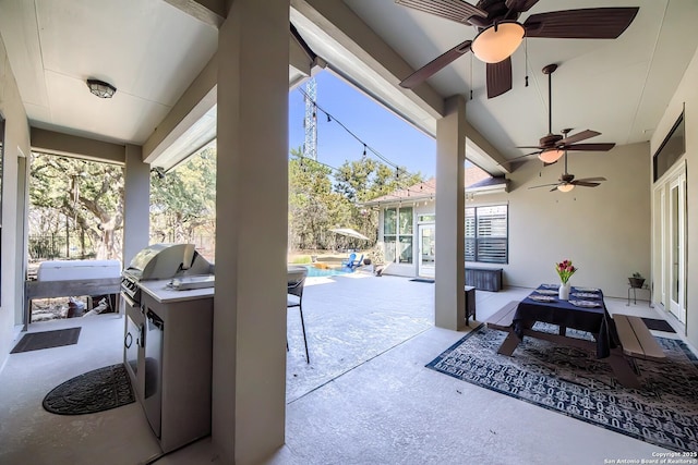 view of patio with a pool, an outdoor kitchen, and a bar