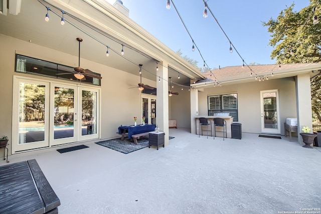 view of patio with french doors, ceiling fan, and an outdoor hangout area