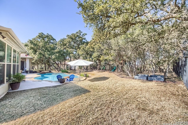 view of yard featuring a patio and a playground