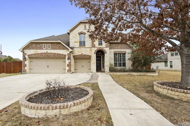 french provincial home featuring a garage