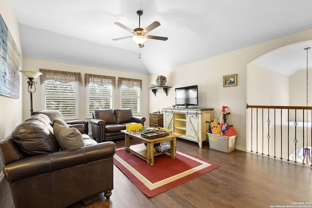 living room with ceiling fan, lofted ceiling, and dark hardwood / wood-style flooring