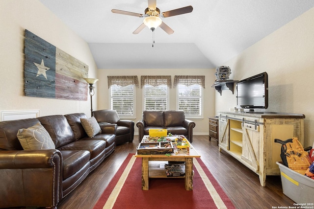 living room featuring ceiling fan, dark hardwood / wood-style flooring, and vaulted ceiling