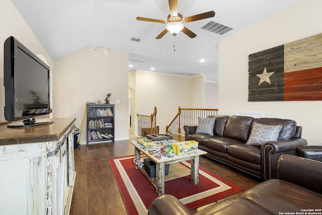 living room featuring dark wood-type flooring, ceiling fan, and vaulted ceiling