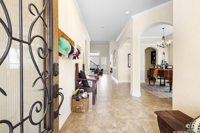 tiled foyer featuring ornamental molding