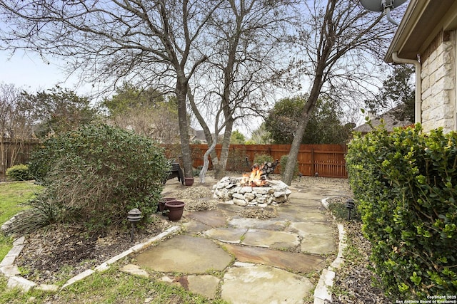 view of yard featuring a patio and a fire pit