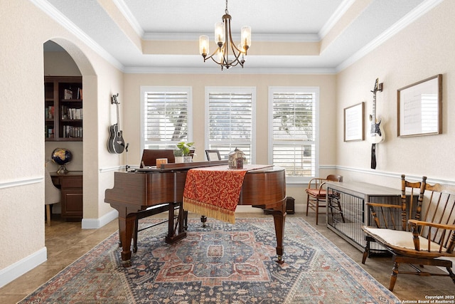 miscellaneous room with an inviting chandelier, tile patterned floors, ornamental molding, and a raised ceiling