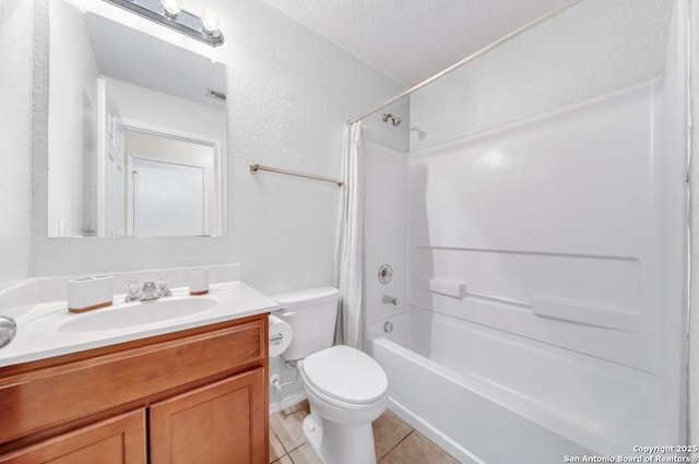 full bathroom with shower / bathing tub combination, vanity, toilet, tile patterned floors, and a textured ceiling