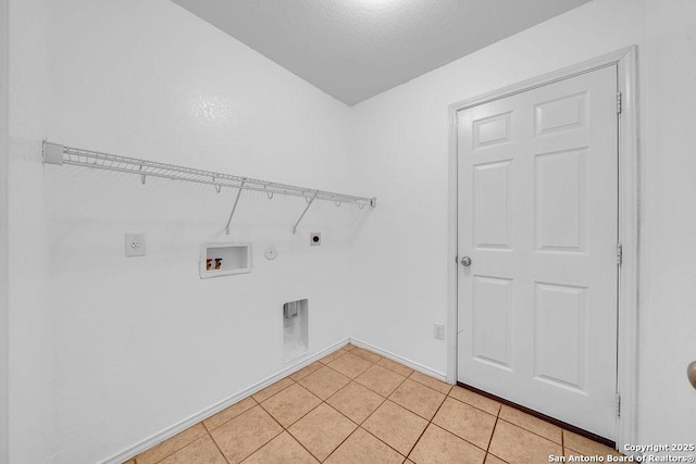 laundry room featuring gas dryer hookup, electric dryer hookup, washer hookup, and light tile patterned floors