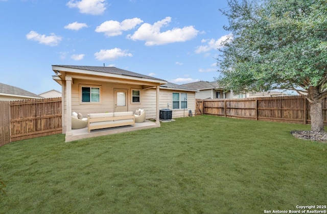 back of property featuring central AC, a patio area, and a lawn