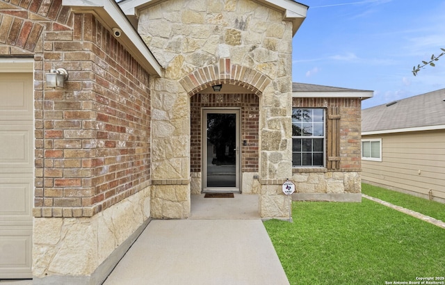 view of exterior entry featuring a garage