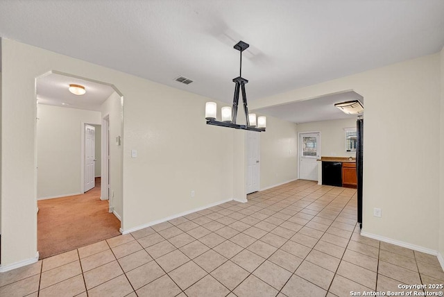 unfurnished dining area with light tile patterned floors