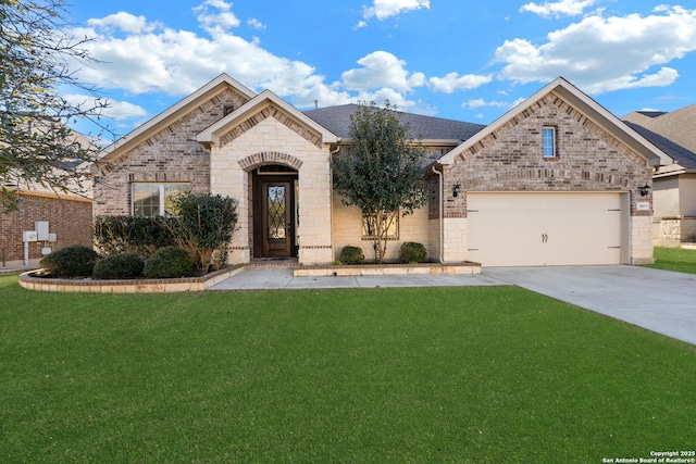 view of front of home with a garage and a front lawn