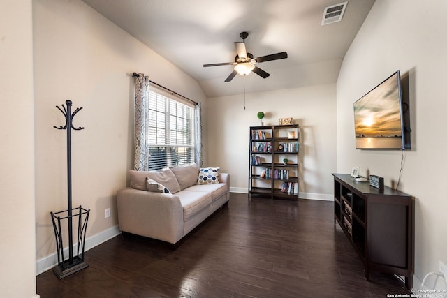 living room with ceiling fan, lofted ceiling, and dark hardwood / wood-style floors