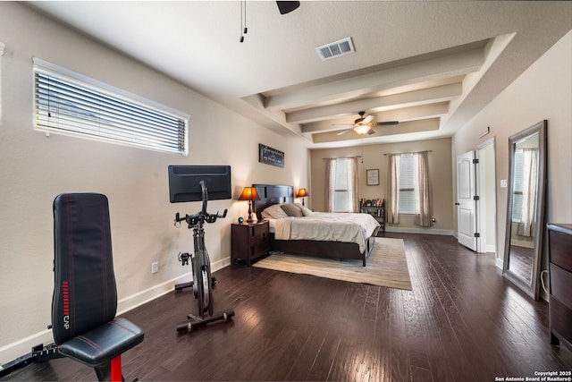 bedroom featuring beamed ceiling, ceiling fan, and dark hardwood / wood-style flooring