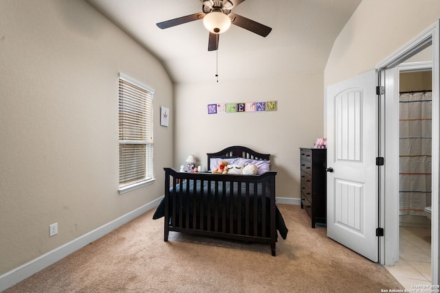 carpeted bedroom with lofted ceiling and ceiling fan