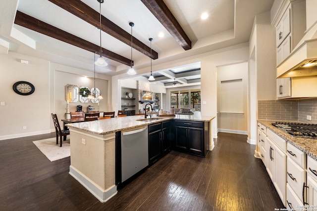 kitchen featuring premium range hood, hanging light fixtures, stainless steel appliances, light stone countertops, and decorative backsplash