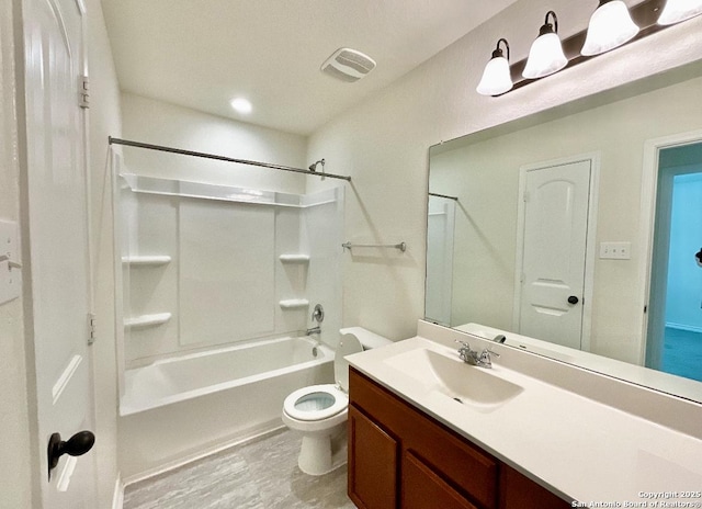 full bathroom featuring shower / bathing tub combination, vanity, and toilet