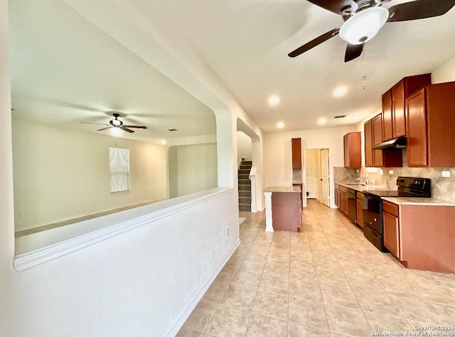 kitchen with light tile patterned flooring, sink, decorative backsplash, and black range with electric cooktop