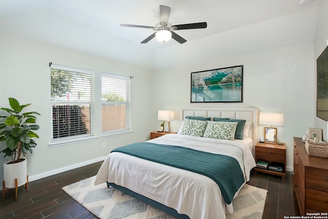 bedroom with ceiling fan, baseboards, and wood finished floors