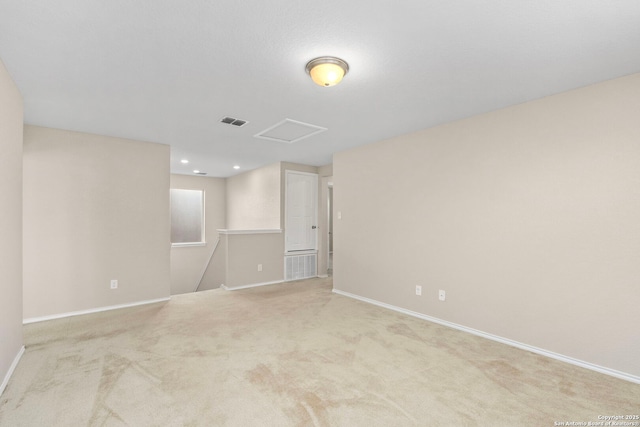 spare room with light colored carpet