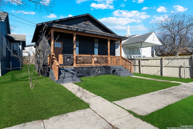 bungalow-style home with a front yard and a porch