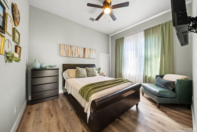 bedroom featuring ceiling fan and light wood-type flooring