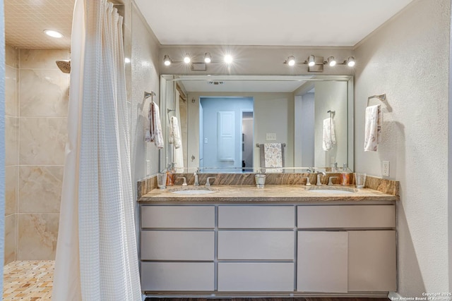 bathroom with vanity and curtained shower