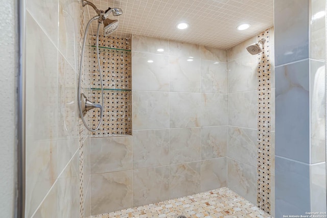 bathroom with a tile shower