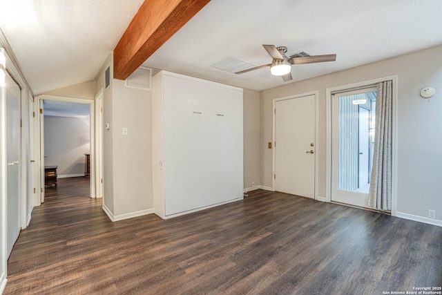 unfurnished room with lofted ceiling with beams, dark hardwood / wood-style floors, and ceiling fan