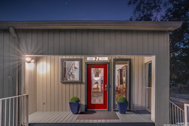 view of exterior entry at twilight