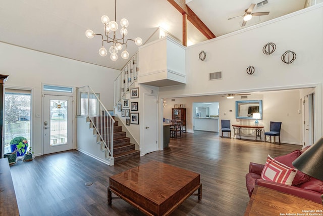 living room with dark wood-type flooring, high vaulted ceiling, ceiling fan with notable chandelier, and beamed ceiling