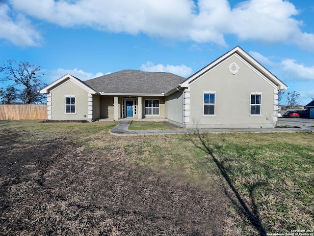 back of property featuring a lawn