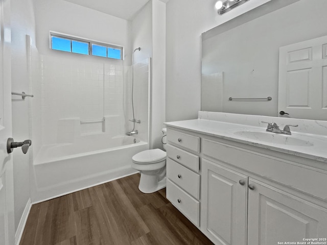 full bathroom with vanity, hardwood / wood-style floors, toilet, and shower / bath combination