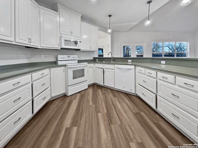 kitchen featuring sink, white appliances, dark wood-type flooring, white cabinetry, and decorative light fixtures