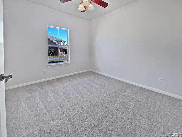 carpeted empty room with ceiling fan