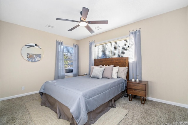 bedroom with ceiling fan and light colored carpet