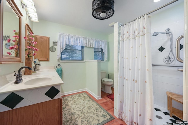 bathroom featuring vanity, curtained shower, tile patterned floors, and toilet