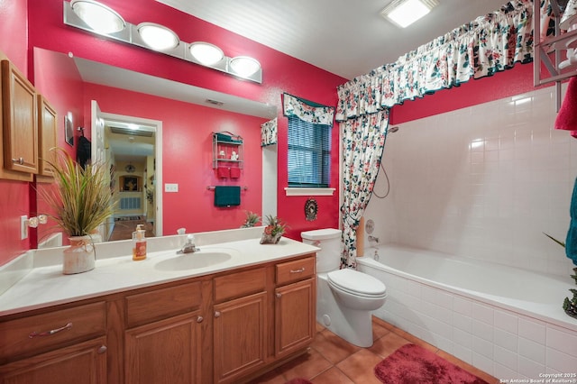 full bathroom with tile patterned floors, vanity, toilet, and shower / bath combo