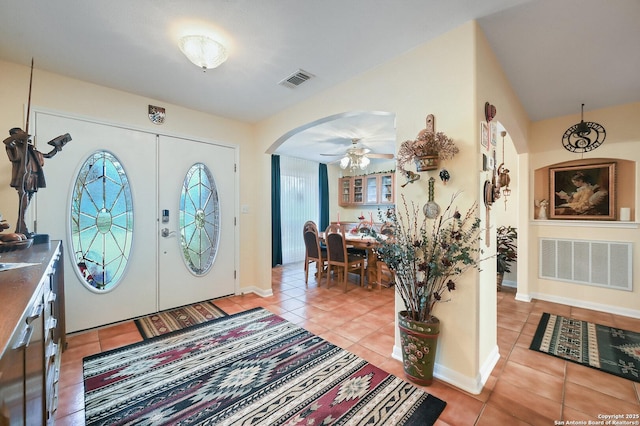 entrance foyer with ceiling fan and light tile patterned floors