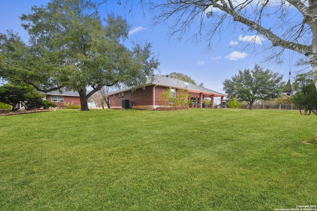 view of yard featuring central AC unit