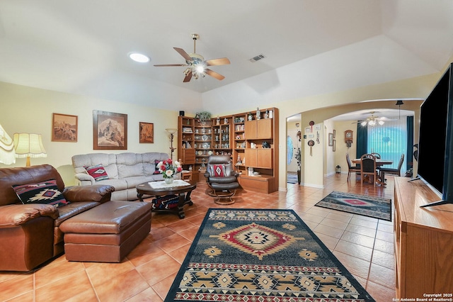 tiled living room with ceiling fan